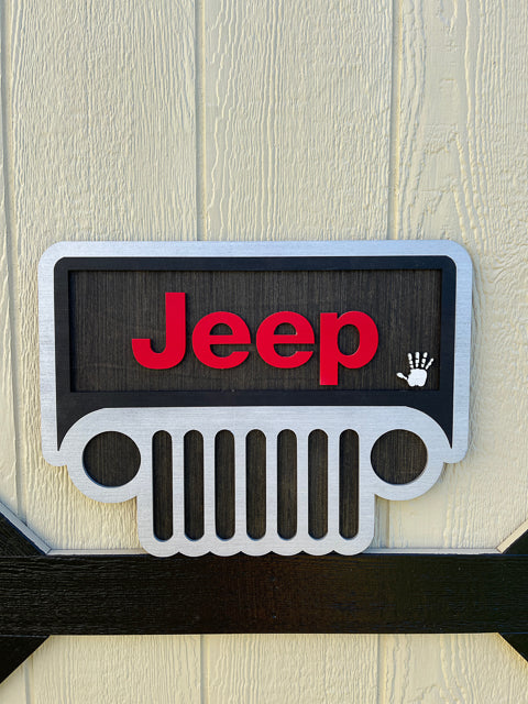 Jeep front with jeep letters  and jeep waving in windshield